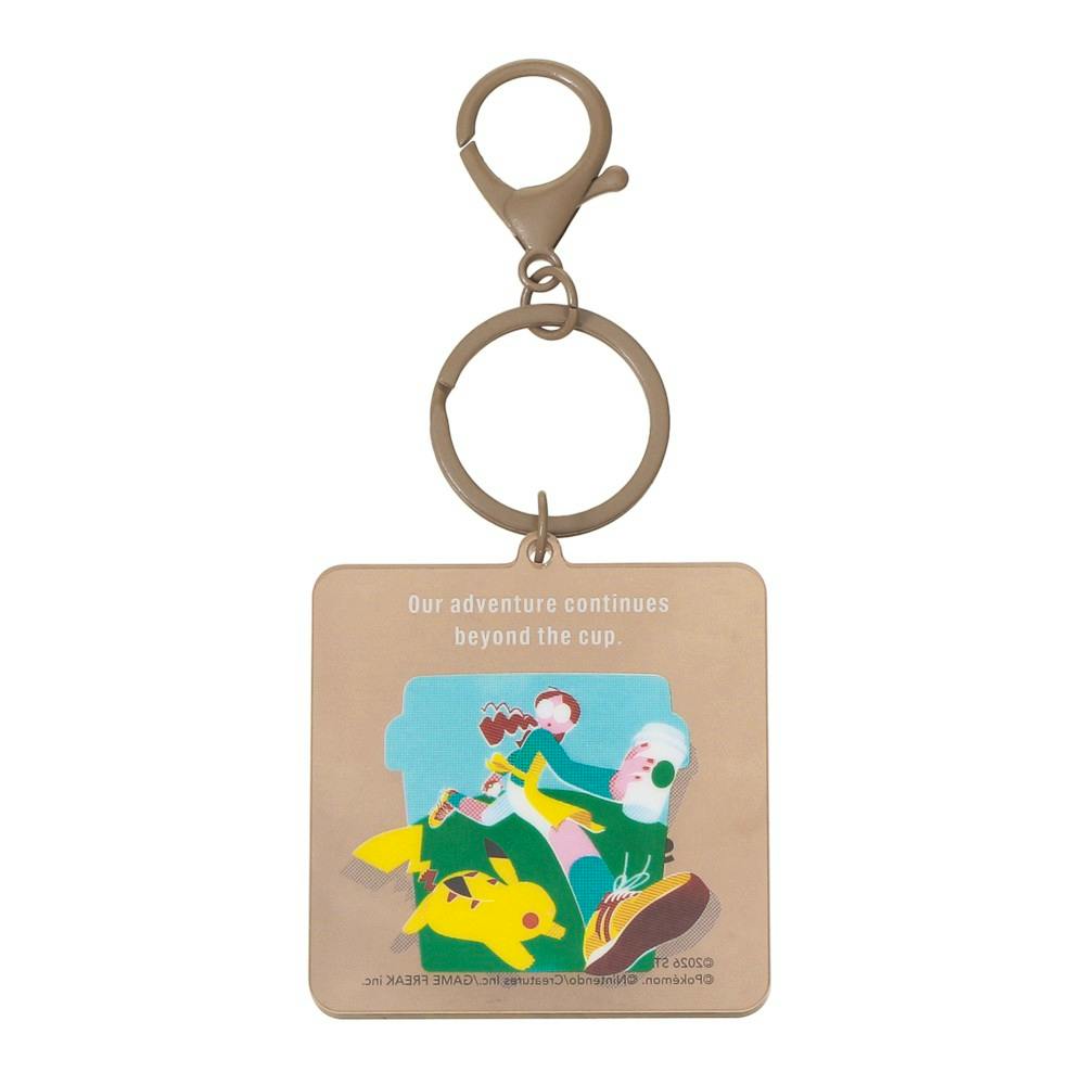 Front view of the Pokémon + STARBUCKS acrylic keychain charm featuring Pikachu and a stylized illustration, shown with metal ring and clasp.