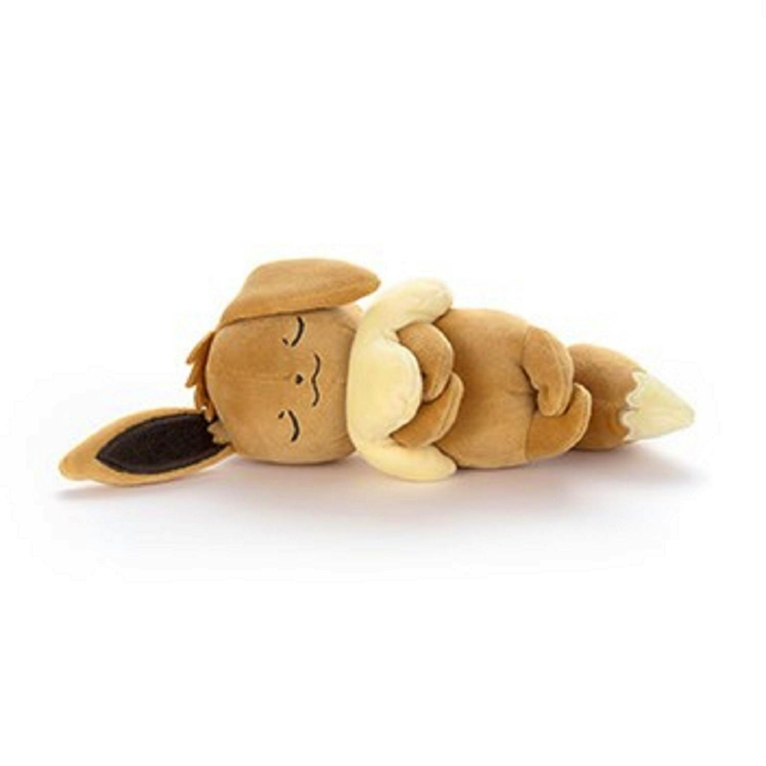 A sleeping Eevee plush toy lying on its side on a white background.