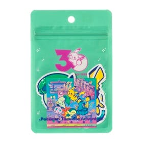 A green resealable pouch showing the Pokémon Timeless Adventure sticker set with colorful Pokémon designs visible through the packaging.