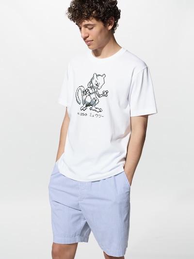 A man wearing a white men's cotton T-shirt with a pixel-art Pokémon graphic and the number 150 on the front.