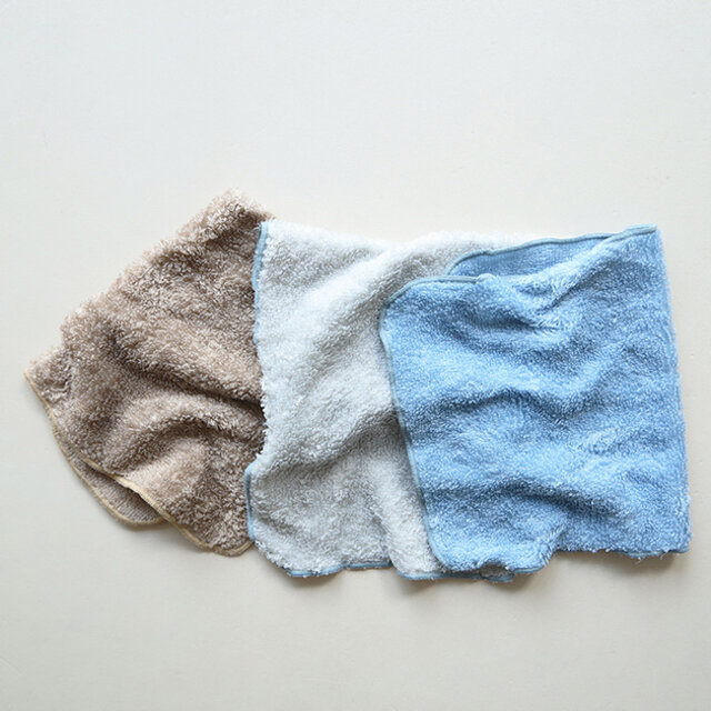 Three polyester handkerchiefs in brown, off-white, and light blue laid flat on a light background.