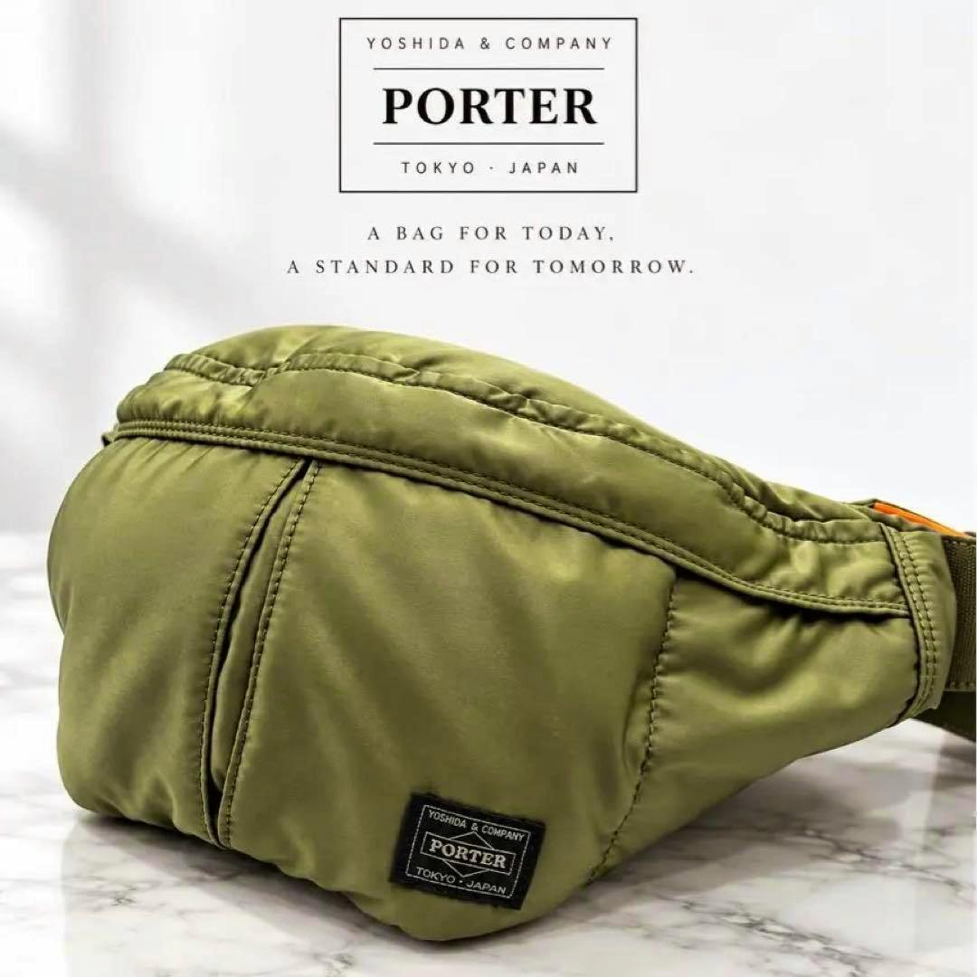 Sage green PORTER Tanker waist bag pictured at an angle on a marble surface with the PORTER label visible.