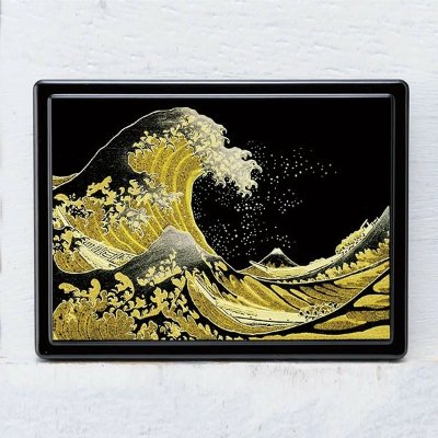 Black lacquer Post-it/sticky-note case featuring a gold decorative wave design.
