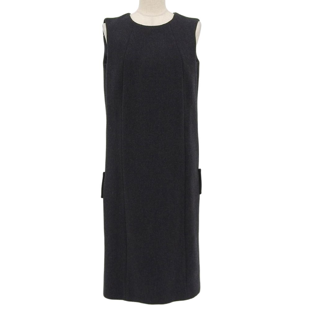 Front view of a dark gray sleeveless Prada wool dress displayed on a mannequin.