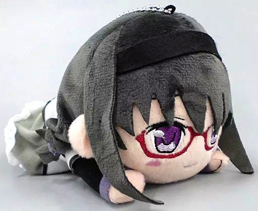 A lying-down plush of Akemi Homura from Magia Record showing her face with red glasses and braided gray hair.