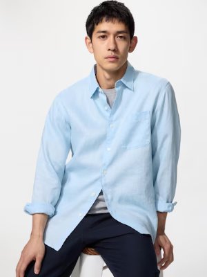 Male model wearing a light blue linen oversized shirt.