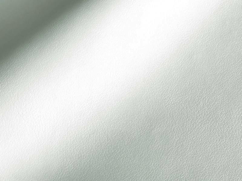 Close-up of white synthetic leather polyester fabric showing fine pebble grain and a soft sheen.