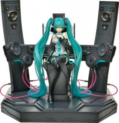 Plastic Hatsune Miku figure seated on a speaker-themed display base.