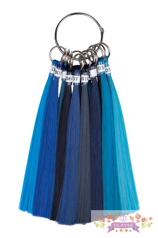 Ring of synthetic wig color swatches showing multiple blue shades fanned out on a white background.