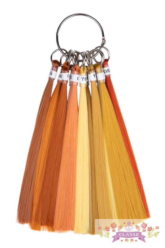 Ring of synthetic wig color chart swatches in orange and yellow tones on a white background.