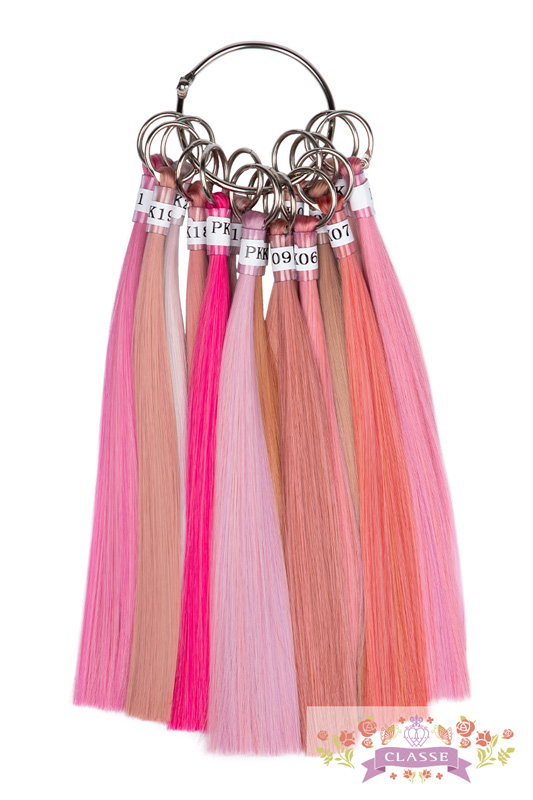 Multiple pink synthetic wig color swatches attached to a metal ring.