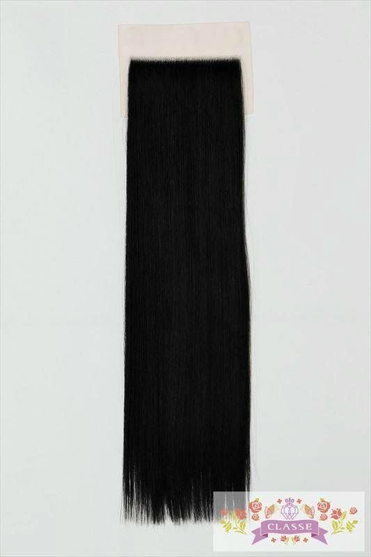 Long black synthetic wig hairpiece (hairline part) attached to a rectangular base on a white background.