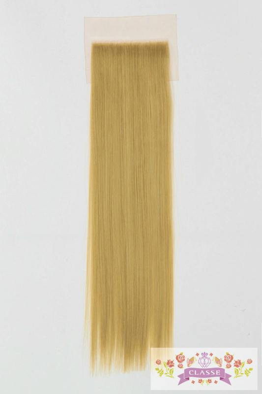Long straight gold-colored wig hairpiece attached to a rectangular skin-toned lace patch on a plain background with a small floral "CLASSE" logo.
