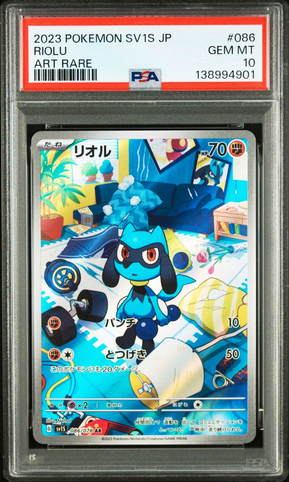 PSA-graded Riolu trading card (SV1S) shown front-facing in a clear PSA slab with label visible.