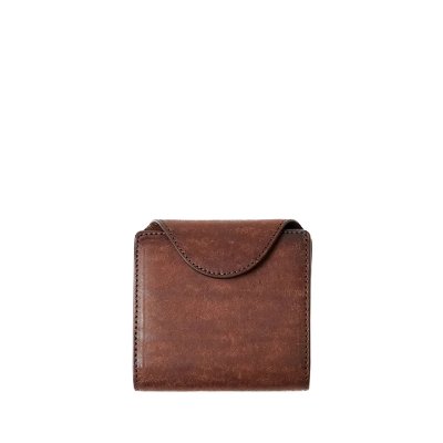 Front view of a brown cow leather mini wallet with a snap-button flap on a white background.