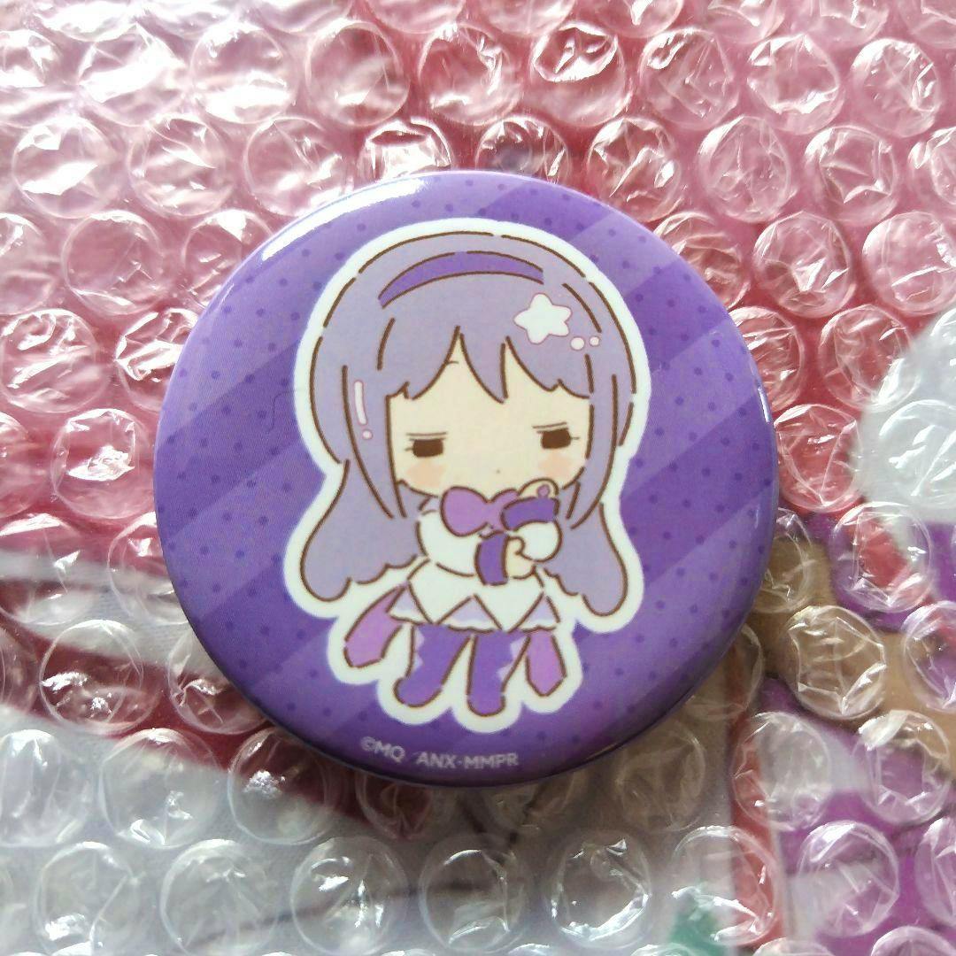 Close-up of a purple round can badge showing a chibi illustration of Homura Akemi from Madoka☆Magica placed on bubble wrap.