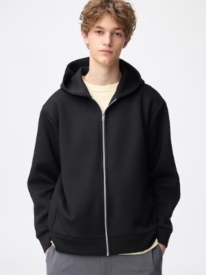 Male model wearing the black full-zip parka against a plain white background.