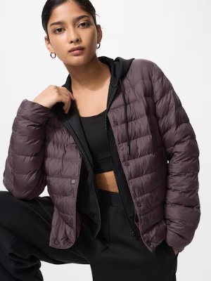 Model wearing the women's nylon compact puff jacket with quilted baffle design.
