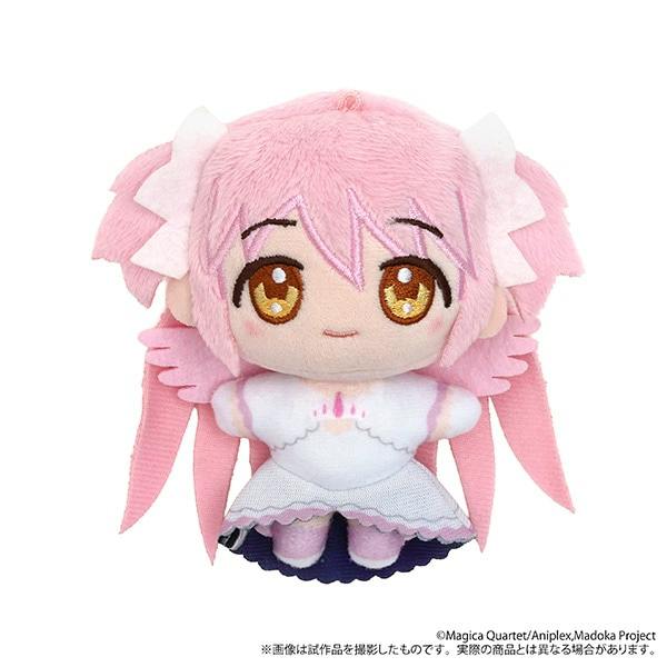 Front view of the Ultimate Madoka plush mascot showing the pink-haired character wearing a white dress.