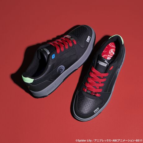Pair of Puma Rebound Slam Lo Zero Recoil CHISATO SET sneakers shown on a red background.
