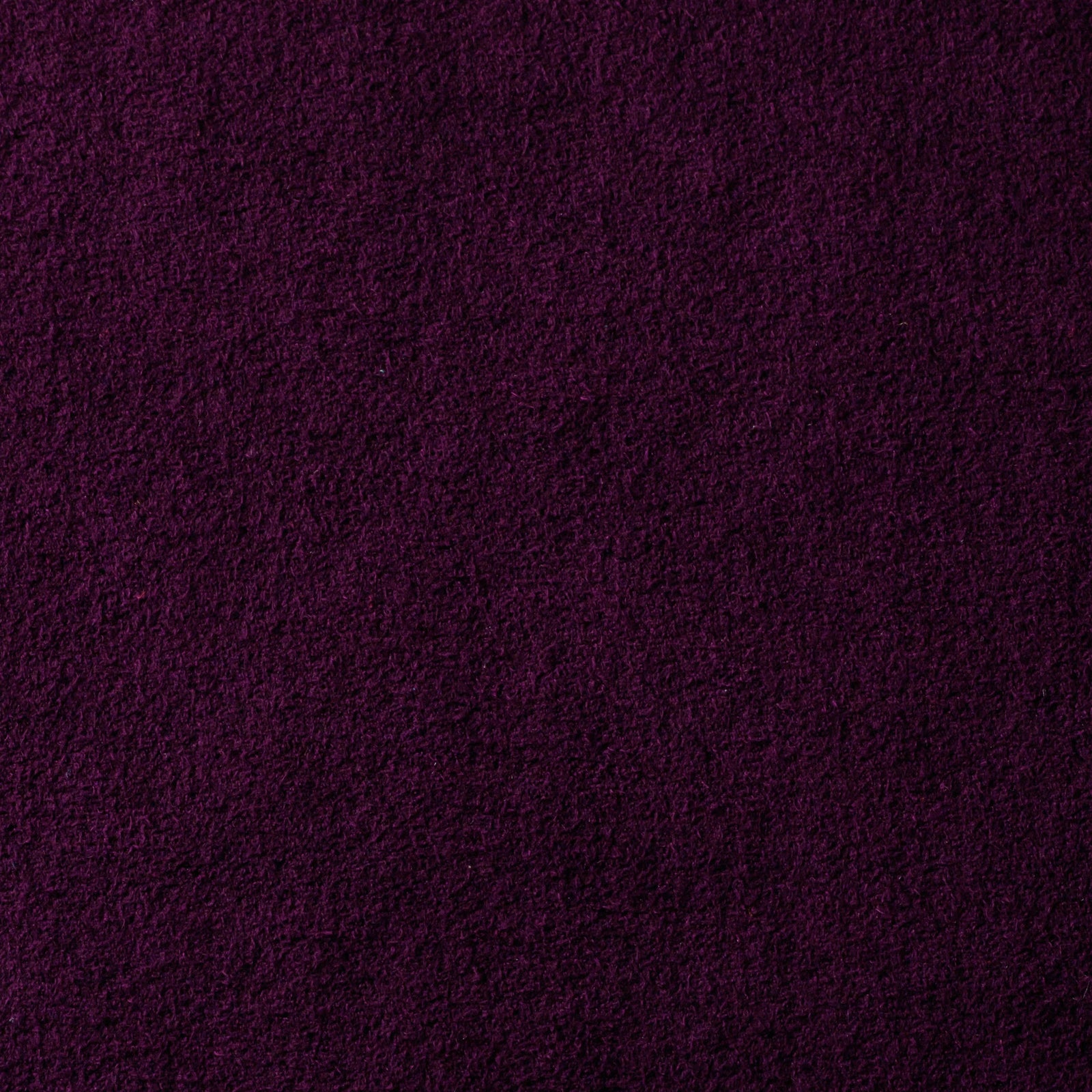 Close-up photo of purple synthetic micro-suede fabric showing its texture.