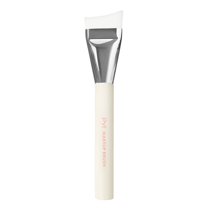 PYT Genba Skin spatula foundation makeup brush with a white handle and angled white bristles on a white background.