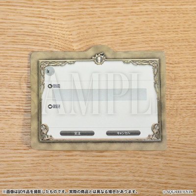 A quest acceptance sticky note shaped like an in-game dialog box placed on a wooden surface.