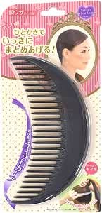 Black crescent-shaped plastic styling comb in retail packaging with printed backing showing a model's hairstyle.