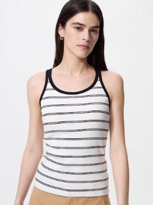 A model wearing a white tank top with black horizontal stripes in a racerback bra-top style.