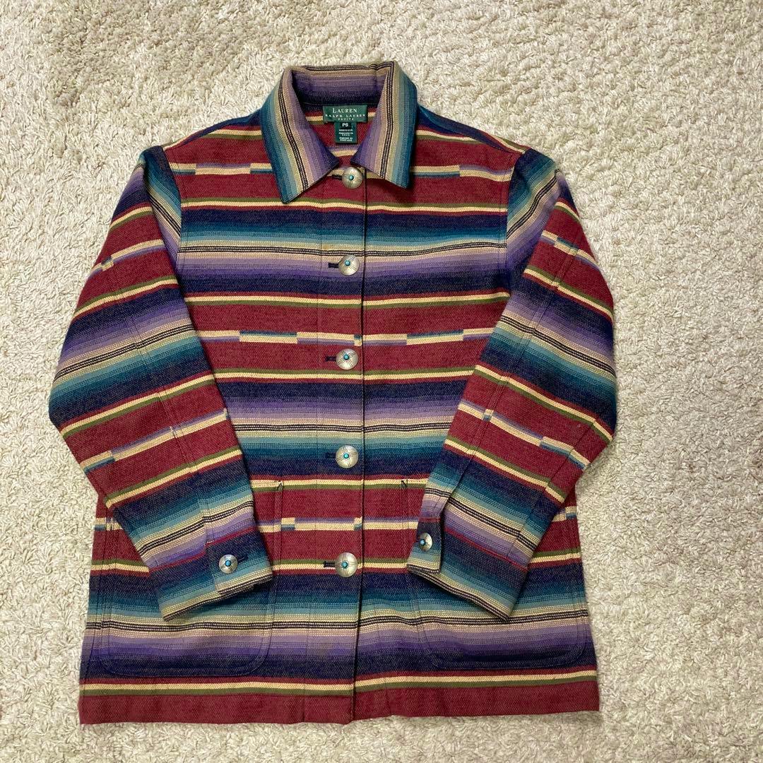 Ralph Lauren native-style striped multicolor rug jacket laid flat on a light carpet, showing front buttons and sleeves.