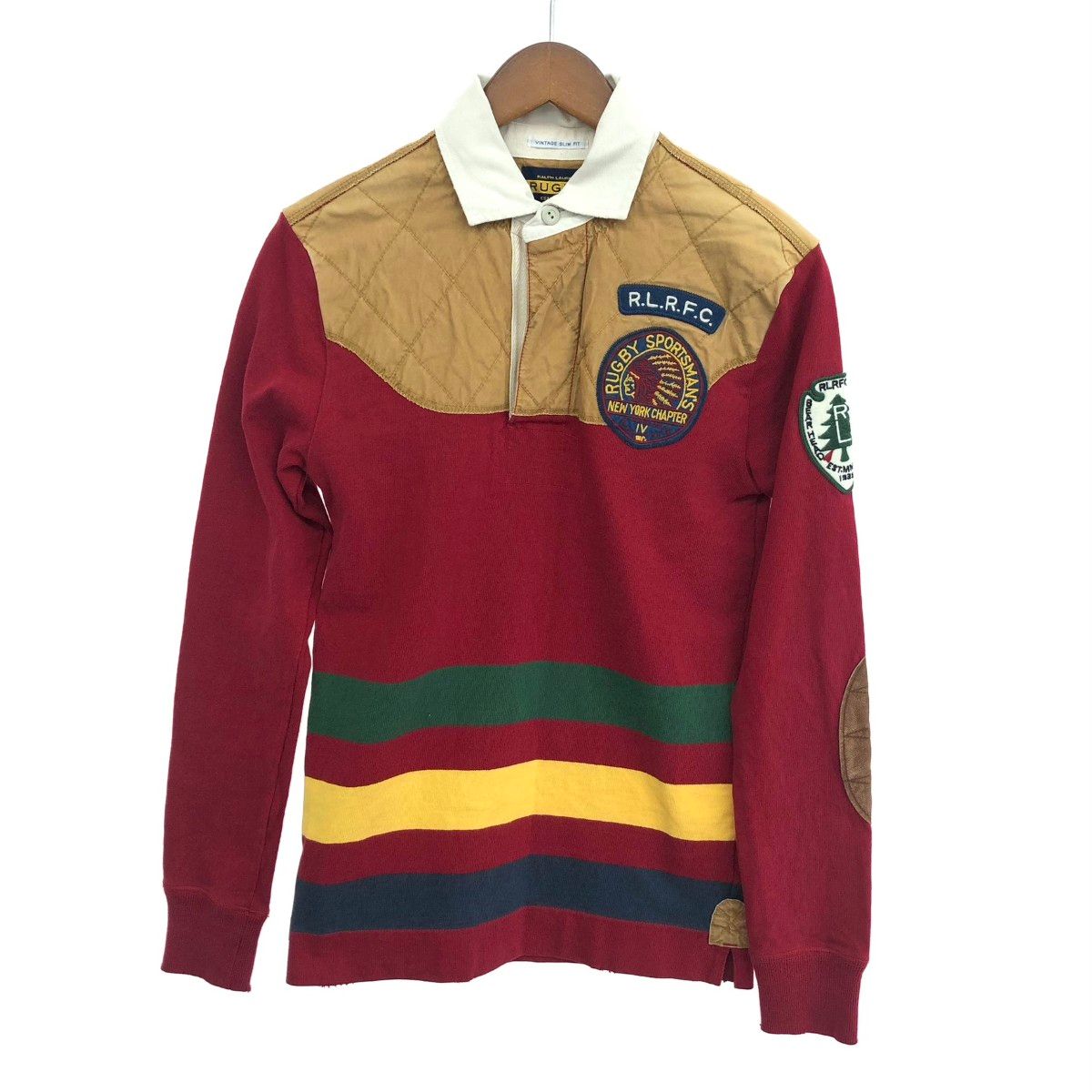 Front view of a men's Ralph Lauren long-sleeve rugby shirt with multicolor stripes, elbow patches, and chest and sleeve patches on a hanger.