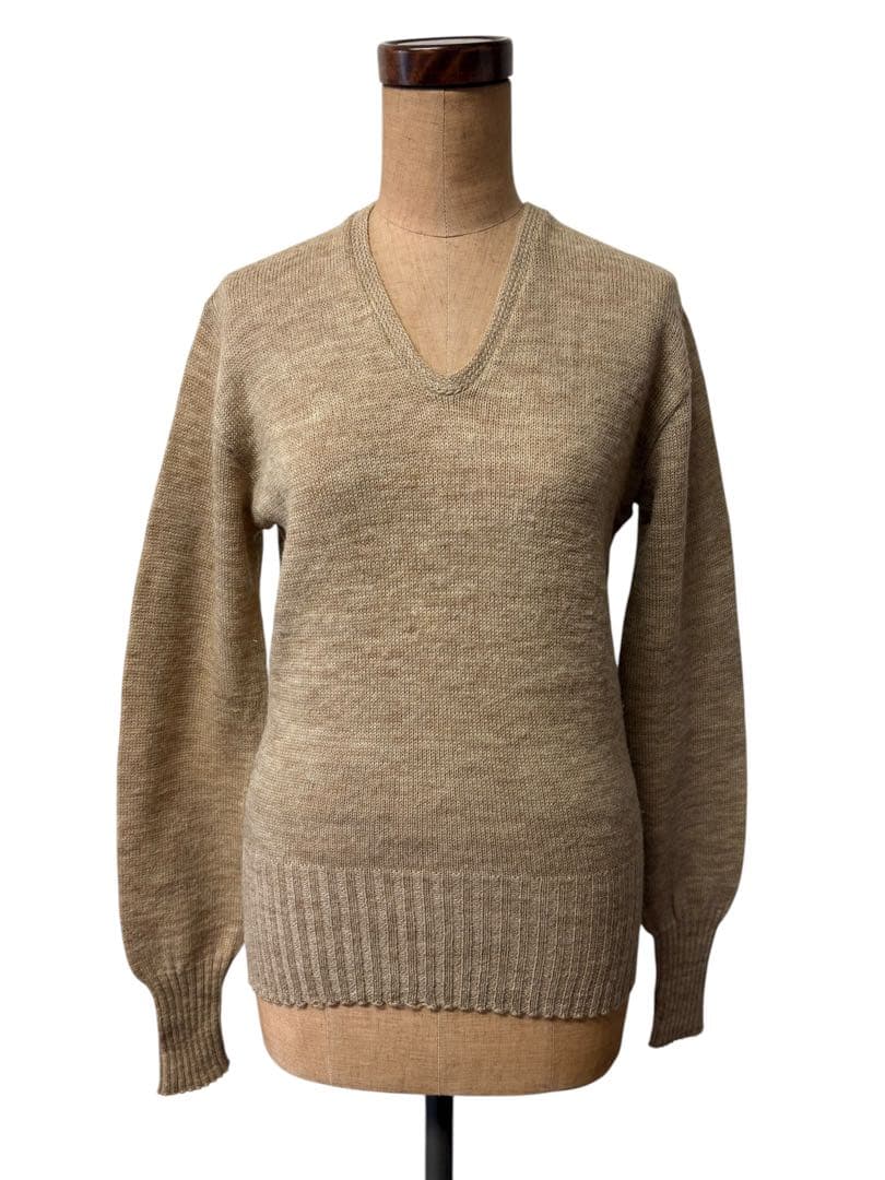 Front view of a vintage women's Brentwood wool V-neck sweater displayed on a dress form.