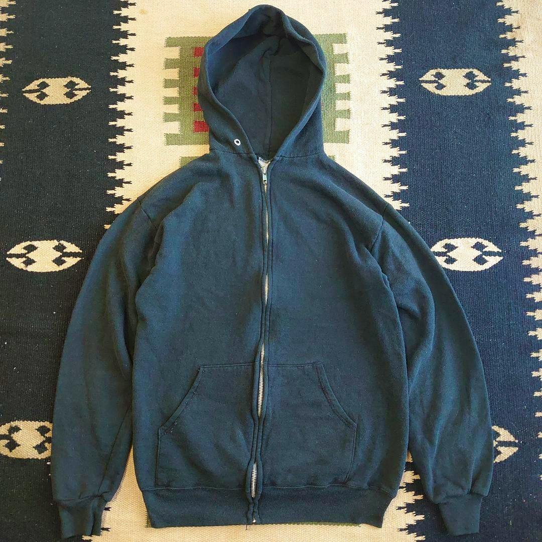 Black full-zip hooded sweatshirt laid flat showing the front, pockets, and zipper.