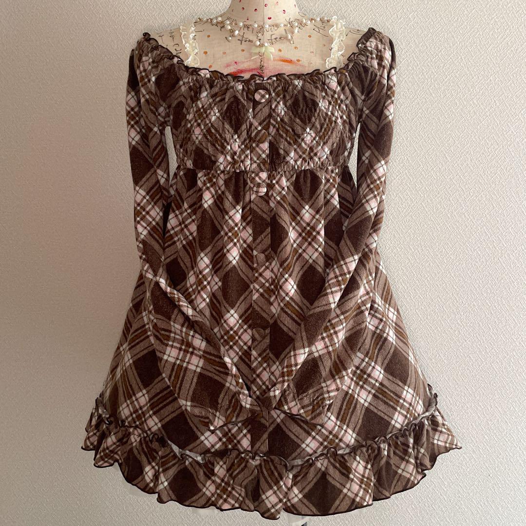 Front view of a brown check off-shoulder shirred frill mini dress displayed on a dress form.