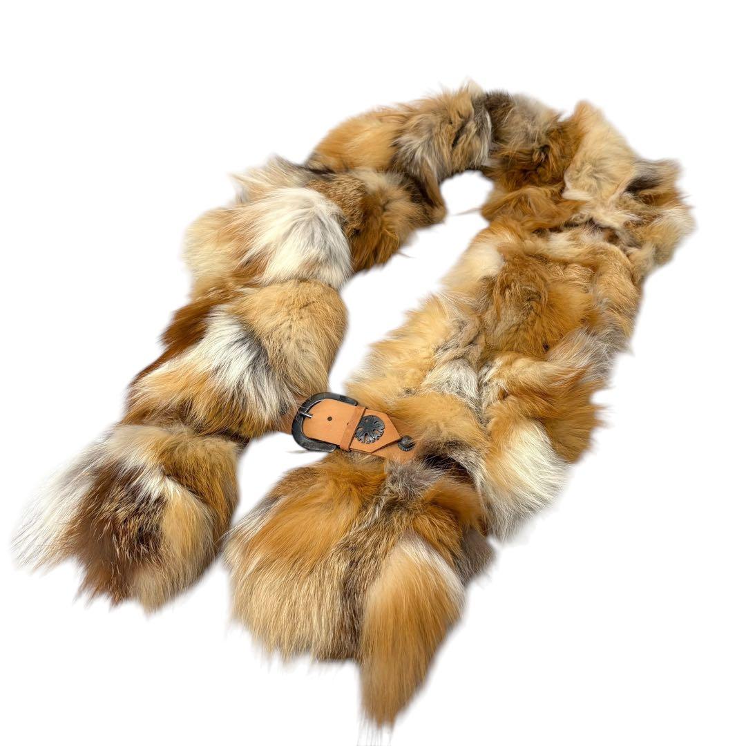 Fox fur scarf/stole laid flat on a white background showing a leather buckle detail.