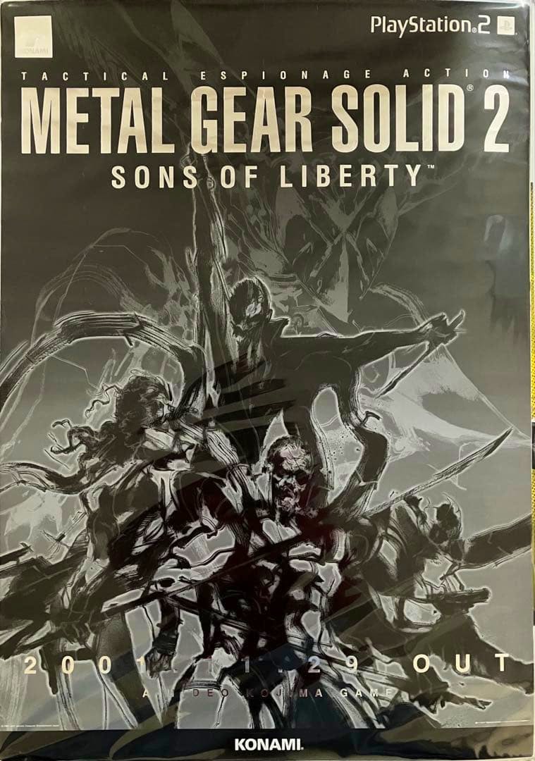 Photograph of a Metal Gear Solid 2: Sons of Liberty promotional poster for PlayStation 2 showing the game title, character artwork, and KONAMI logo.