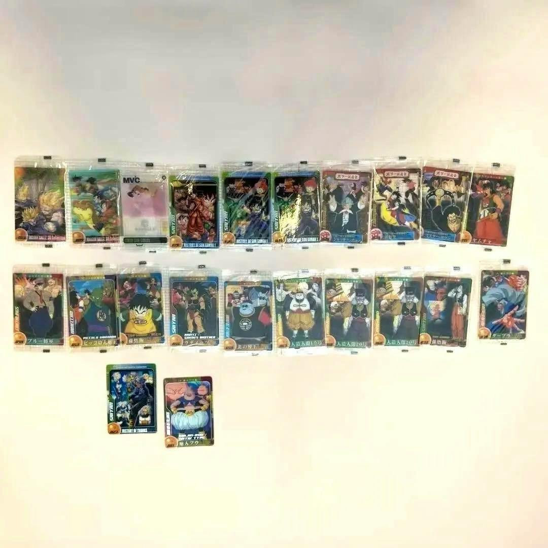 Many Dragon Ball wafer photocard cards arranged in rows on a white background, most shown in individual sealed packaging.