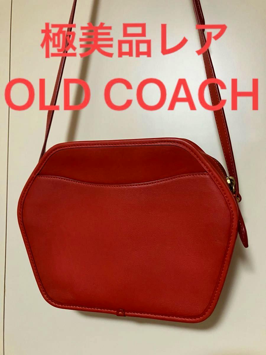 Red leather Old Coach shoulder bag with a hexagonal shape and long strap shown against a white background.