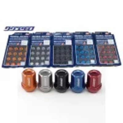 Five colored wheel lock nuts displayed in front of their blue retail packaging.