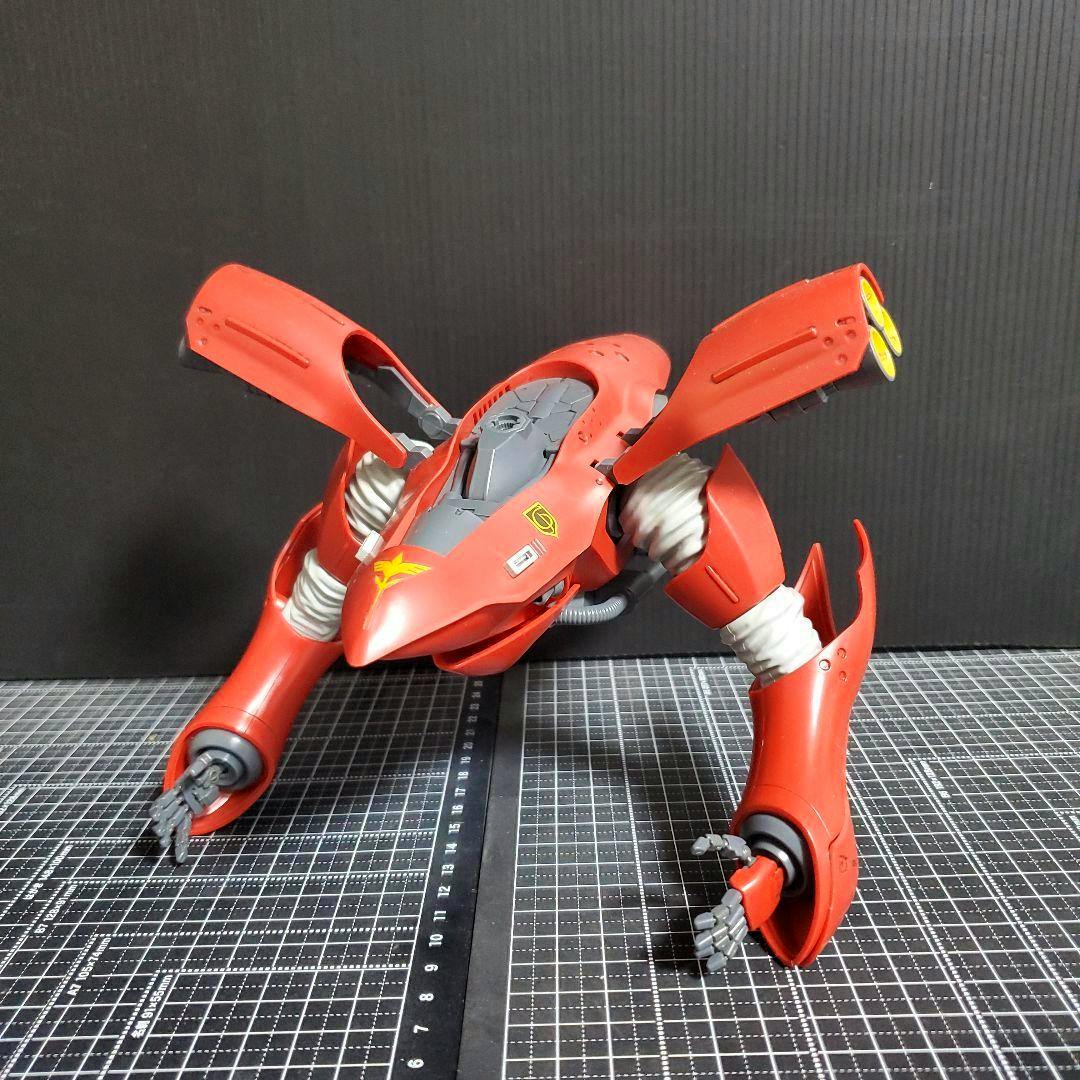 RE/100 Nightingale chest and arm parts in red assembled and displayed on a cutting mat against a dark background.