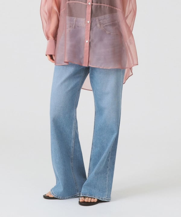 Model wearing the women's cotton jeans shown full-length in a light-blue wash.