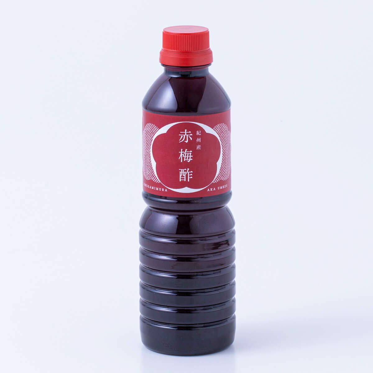 A 500ml bottle of 赤梅酢 (red ume vinegar) with a red label and cap on a white background.