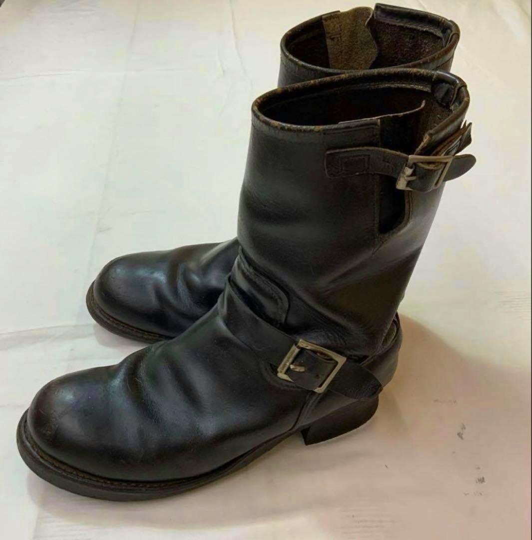 Pair of Red Wing PT91 engineer leather boots shown from a top-side angle on a white surface.
