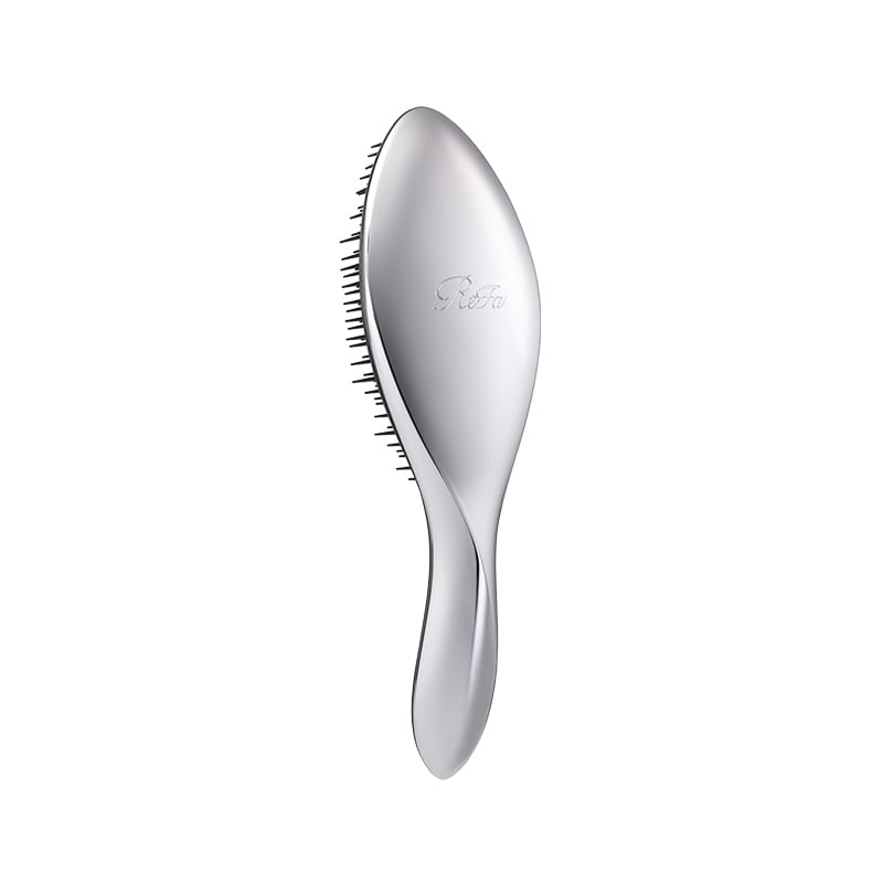 Silver hair brush on a white background showing the bristles and handle.