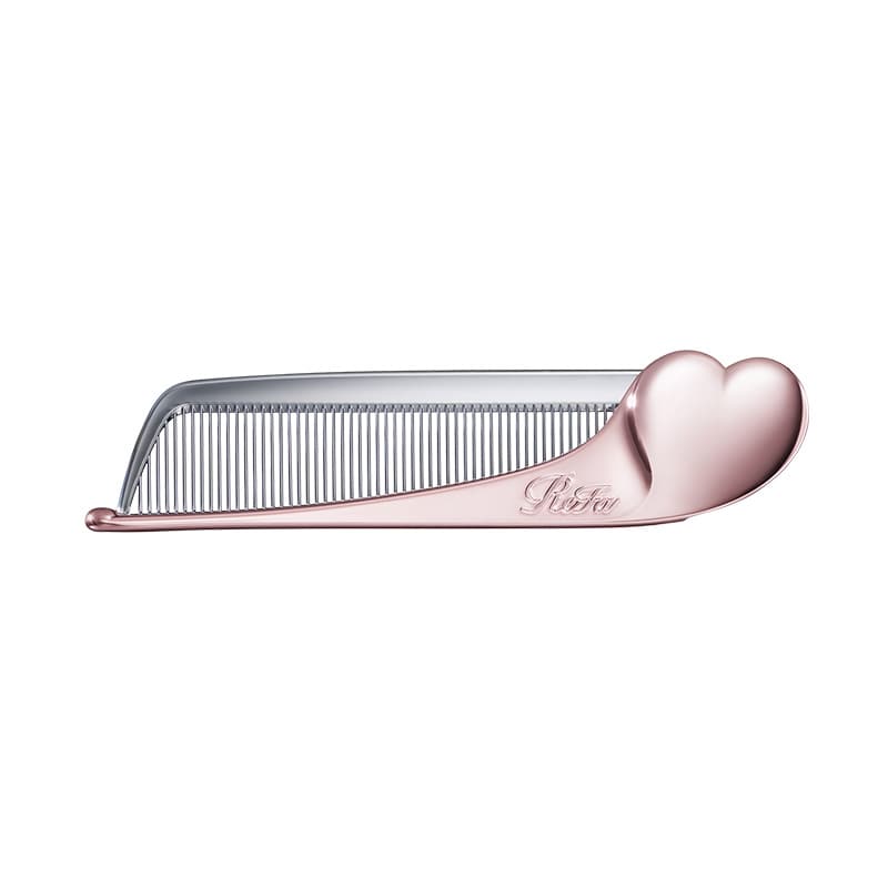 Rose-gold plastic hair comb with a heart-shaped handle and fine teeth on a white background.