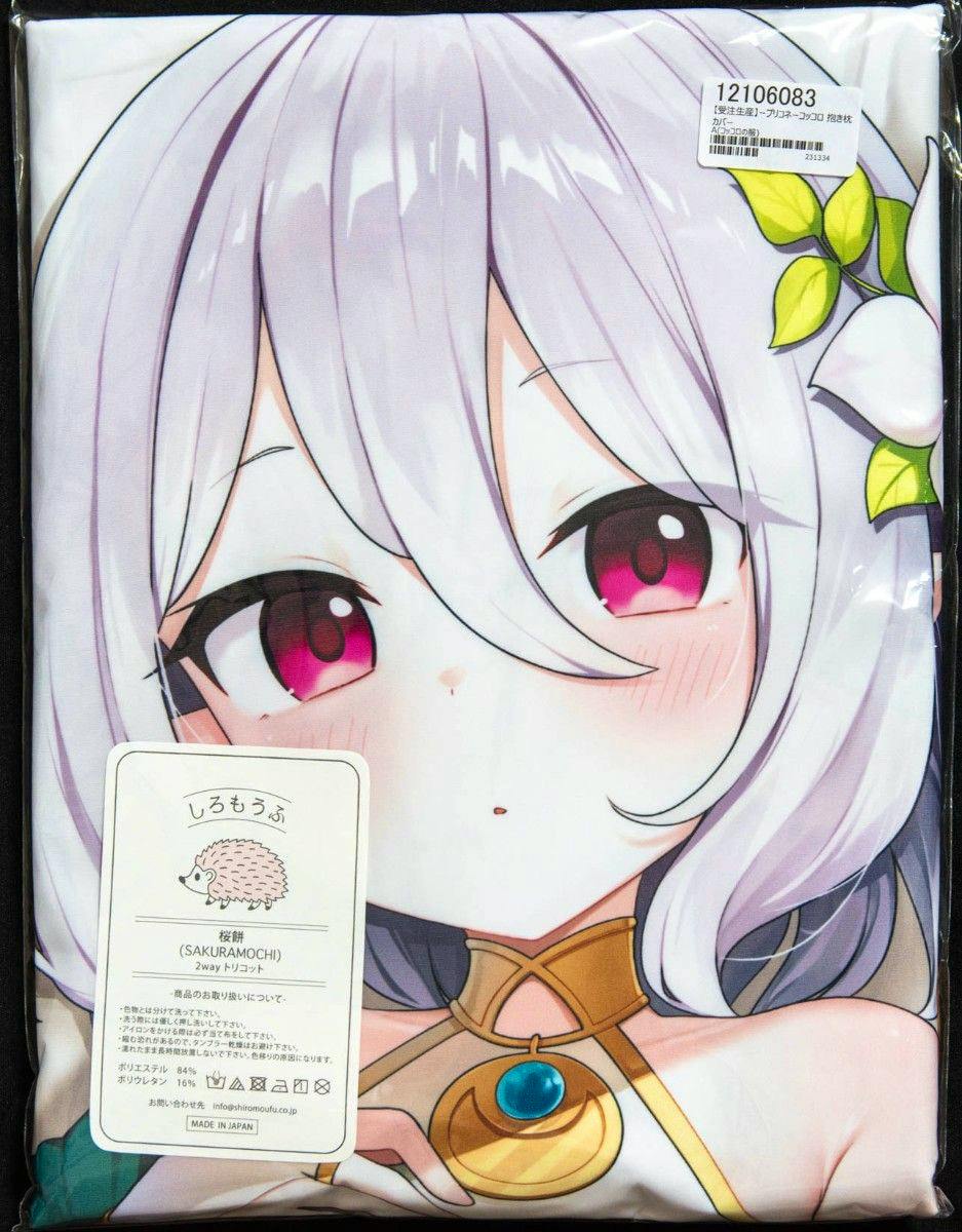 Packaged polyester pillow cover printed with an anime character's face and upper torso with white hair and pink eyes.