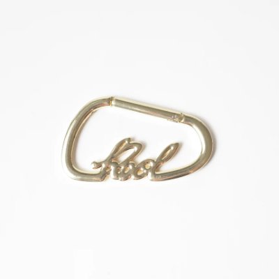 Gold Reol signature carabiner shown on a white background.