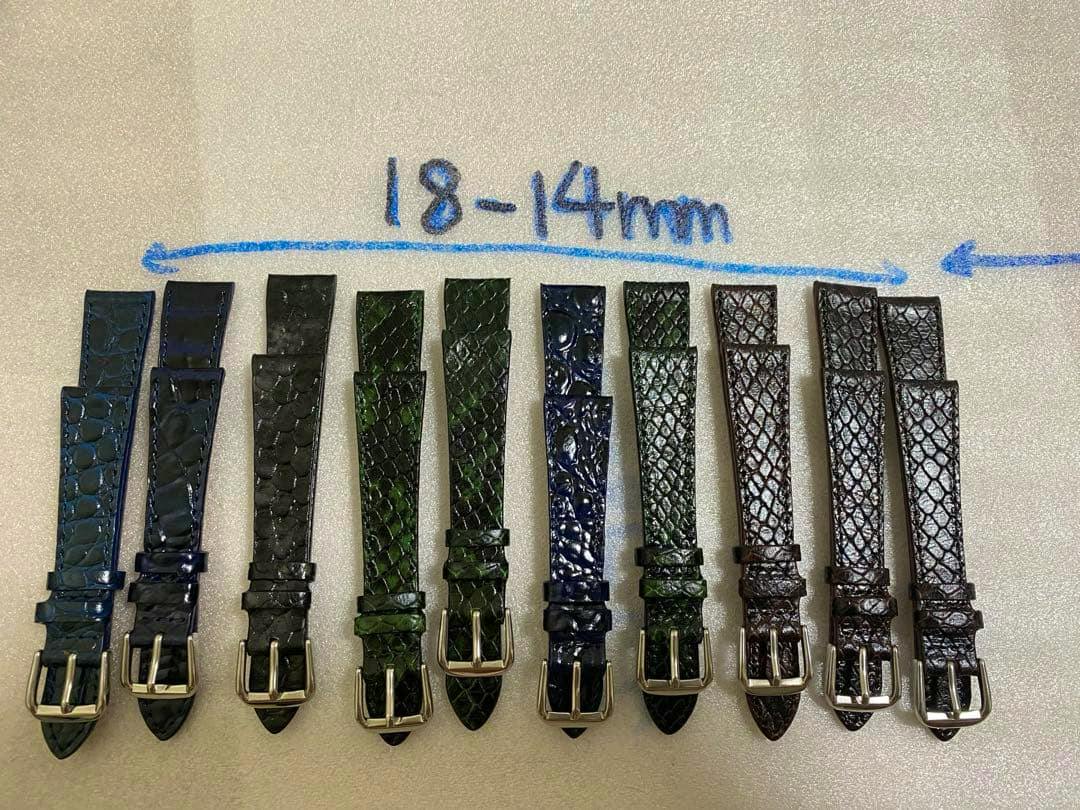 Ten replacement watch straps with crocodile-texture and metal buckles arranged side-by-side with “18-14mm” written above.