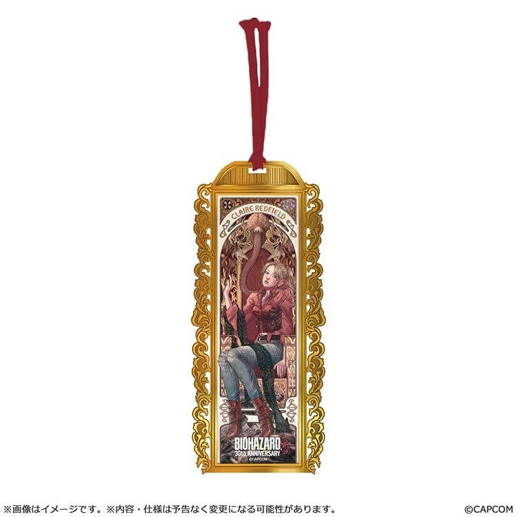 Gold-framed metal bookmark with an illustration of Claire Redfield seated and a red tassel.