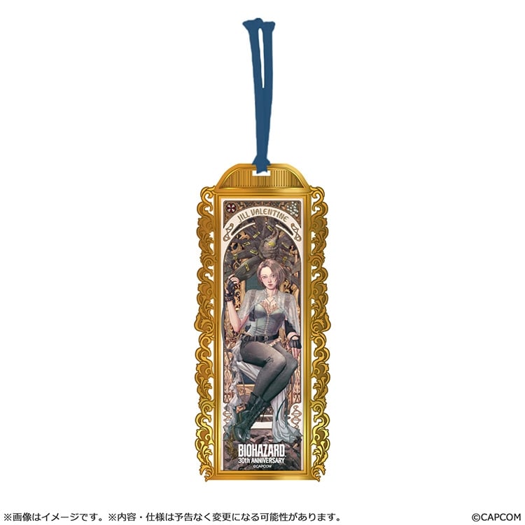 Metal bookmark showing a Jill illustration within an ornate gold frame and a blue tassel.